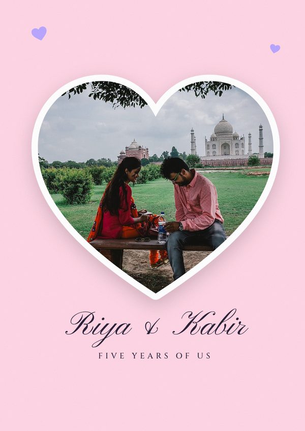 A blush pink cover with a couple at the Taj Mahal inside a heart