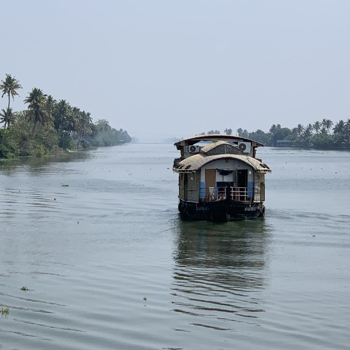 A houseboat on the palm-lined Alleppey backwaters, Kerala